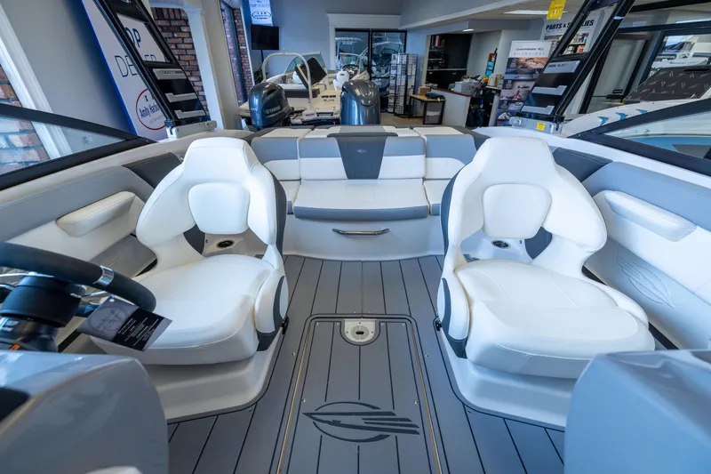 Slide: The Image of Interior of 2025 Chaparral 21 SSi OB boat with white seating and modern design. - 11