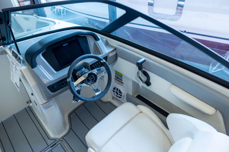 Slide: The Image of 2025 Chaparral 21 SSi OB boat interior with modern steering and dashboard design. - 20