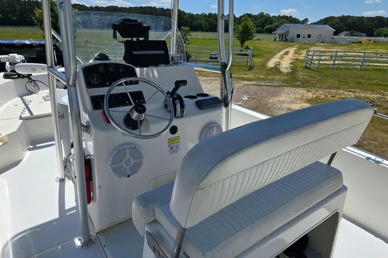 Slide: The Image of 2017 Boston Whaler 210 Montauk boat interior with steering console and seating. - 10