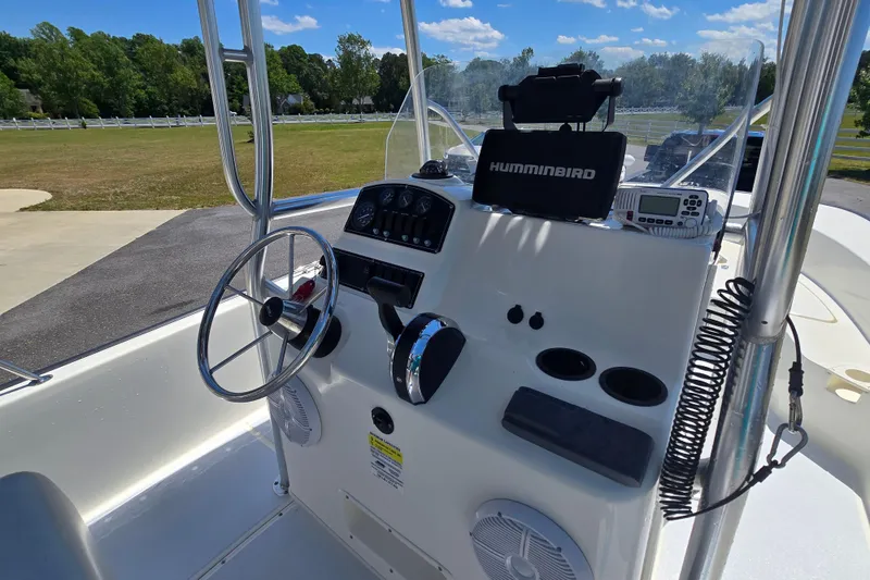 Slide: The Image of 2017 Boston Whaler 210 Montauk boat console with steering wheel and navigation equipment. - 14