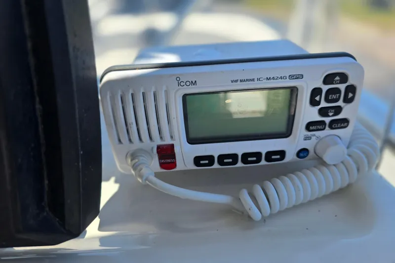 Slide: The Image of VHF marine radio on 2017 Boston Whaler 210 Montauk boat dashboard. - 17