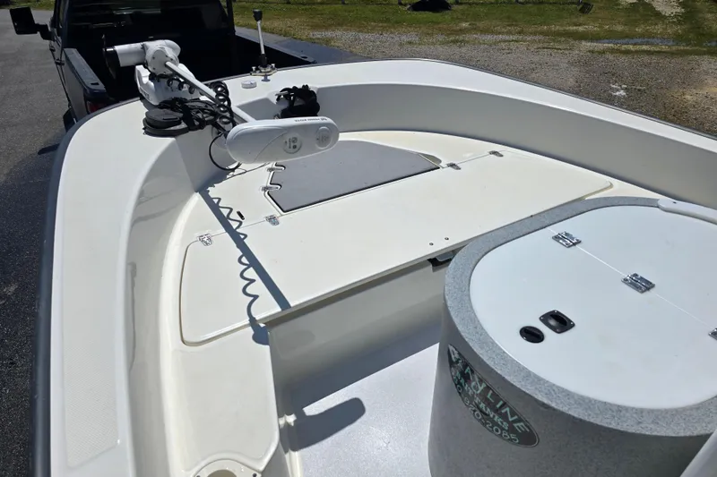 Slide: The Image of 2017 Boston Whaler 210 Montauk boat deck with mounted equipment and storage compartments. - 21