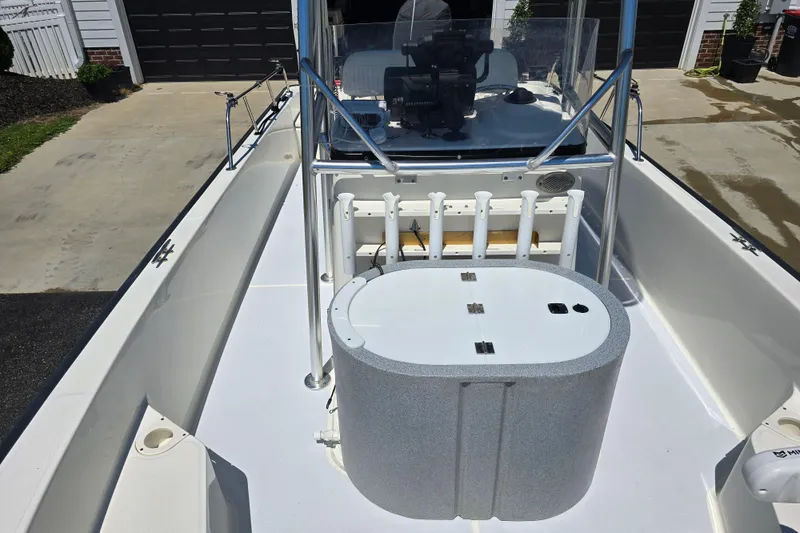 Slide: The Image of 2017 Boston Whaler 210 Montauk boat interior with rod holders and console. - 22
