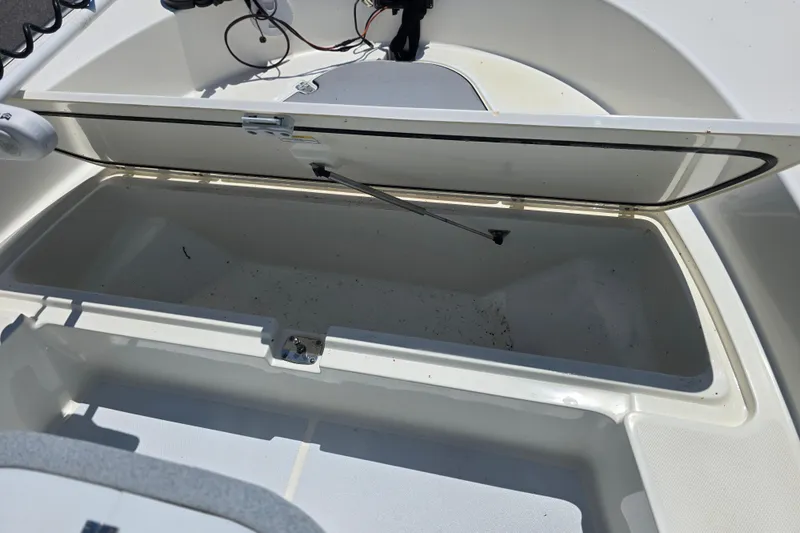 Slide: The Image of Open storage compartment on a 2017 Boston Whaler 210 Montauk boat. - 23