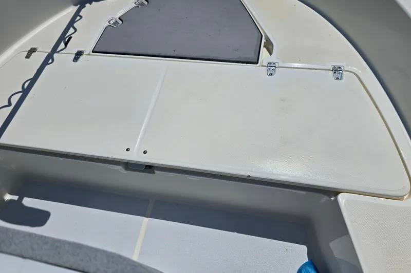Slide: The Image of 2017 Boston Whaler 210 Montauk deck with storage compartments and clean surface. - 24