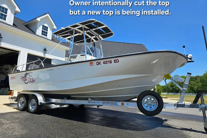 Slide: The Image of 2017 Boston Whaler 210 Montauk on trailer, new top installation in progress. - 3
