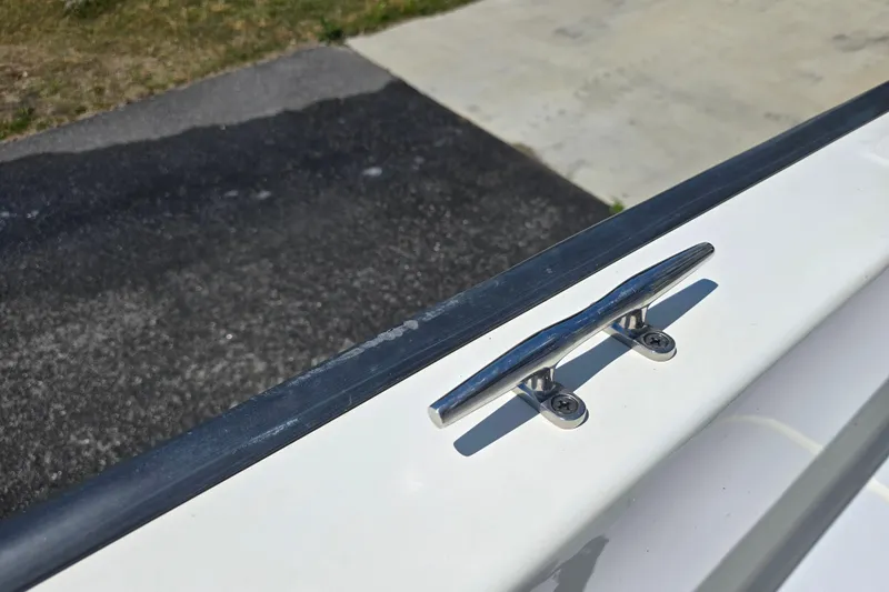 Slide: The Image of 2017 Boston Whaler 210 Montauk boat cleat on white deck, close-up view. - 31