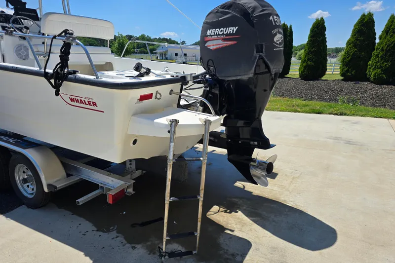 Slide: The Image of 2017 Boston Whaler 210 Montauk boat with Mercury engine on trailer. - 7