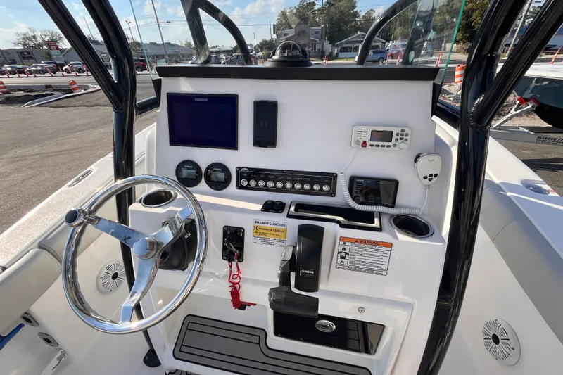Slide: The Image of 2020 Sea Fox 248 Commander boat dashboard with steering wheel and navigation controls. - 11