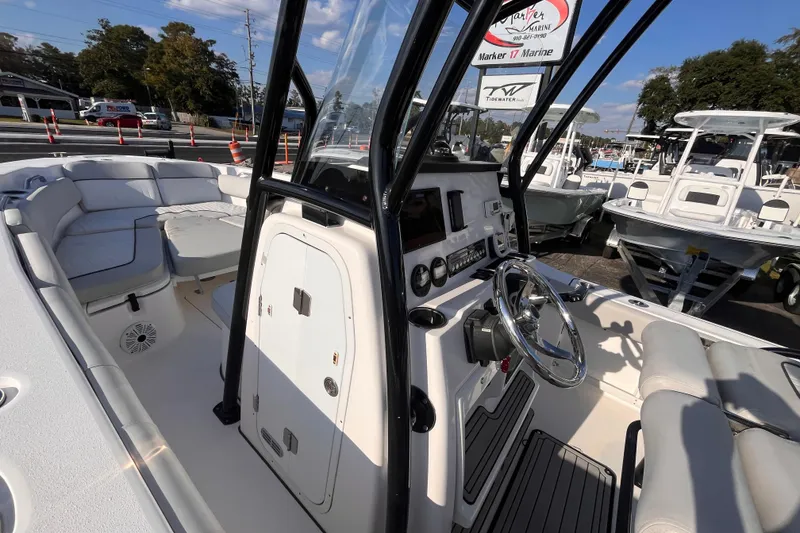 Slide: The Image of 2020 Sea Fox 248 Commander boat interior with steering console and seating area. - 15