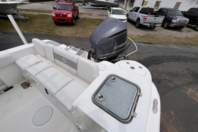 Slide: The Image of 2020 Sea Fox 248 Commander boat with Yamaha outboard motor, parked near trucks. - 17