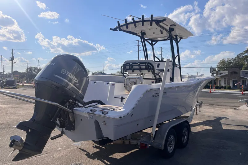 Slide: The Image of 2020 Sea Fox 248 Commander boat with Yamaha engine on trailer under blue sky. - 5