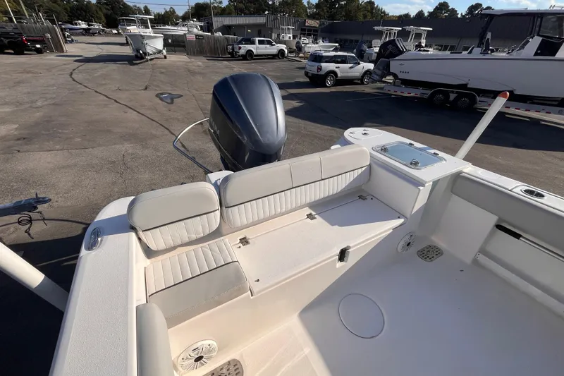 Slide: The Image of 2020 Sea Fox 248 Commander boat interior with seating and motor view. - 6
