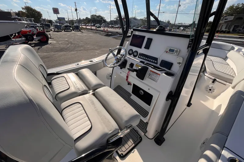 Slide: The Image of 2020 Sea Fox 248 Commander boat interior with steering console and seating. - 9