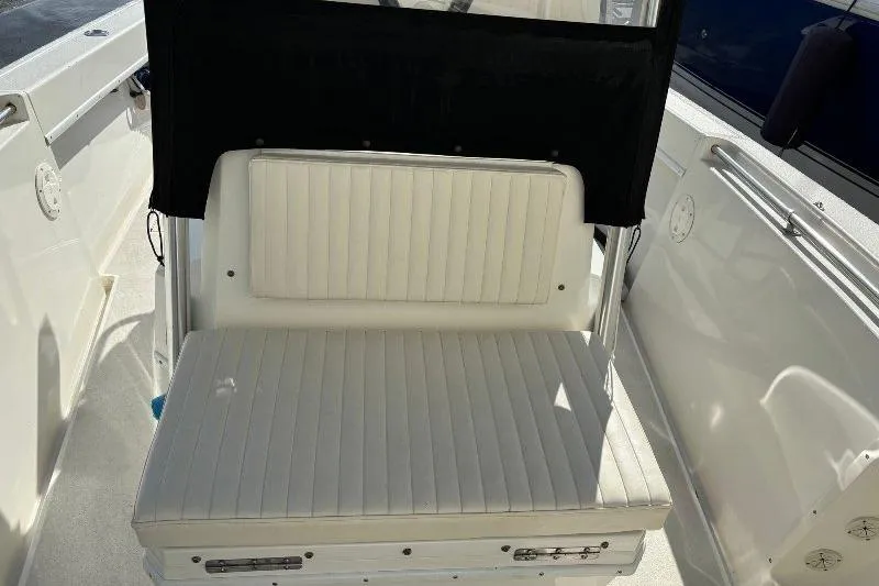 Slide: The Image of White cushioned seating on a 1999 Contender 23 Open boat. - 16