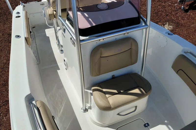 Slide: The Image of 2020 NauticStar 20 XS boat interior with beige seating and stainless steel railings. - 13