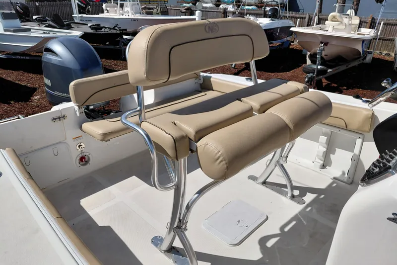 Slide: The Image of 2020 NauticStar 20 XS boat interior with beige seating and Yamaha outboard motor. - 22