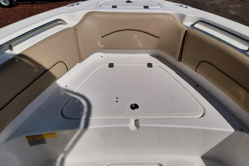 Slide: The Image of 2020 NauticStar 20 XS boat interior with beige seating and white deck. - 35