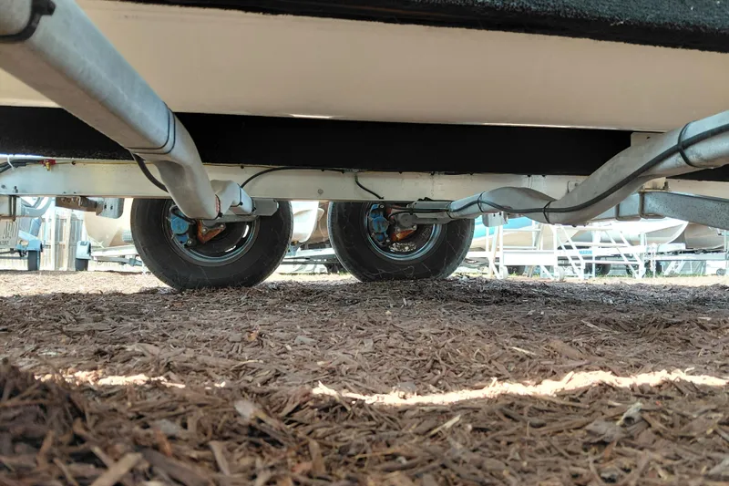 Slide: The Image of Underneath view of a 2020 NauticStar 20 XS boat trailer with dual wheels. - 36