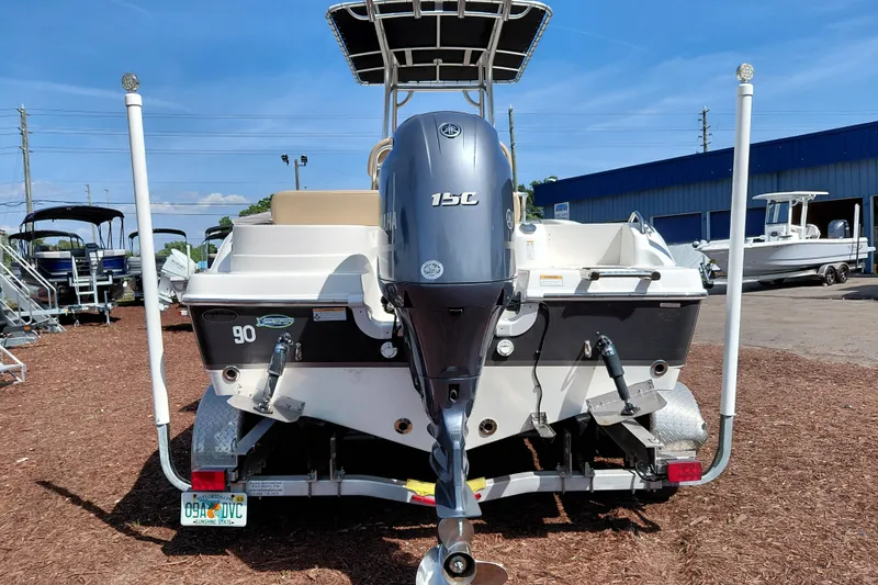 Slide: The Image of 2020 NauticStar 20 XS boat with Yamaha 150C engine, parked outdoors. - 8