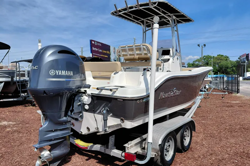 Slide: The Image of 2020 NauticStar 20 XS boat with Yamaha engine on trailer, outdoor display. - 9