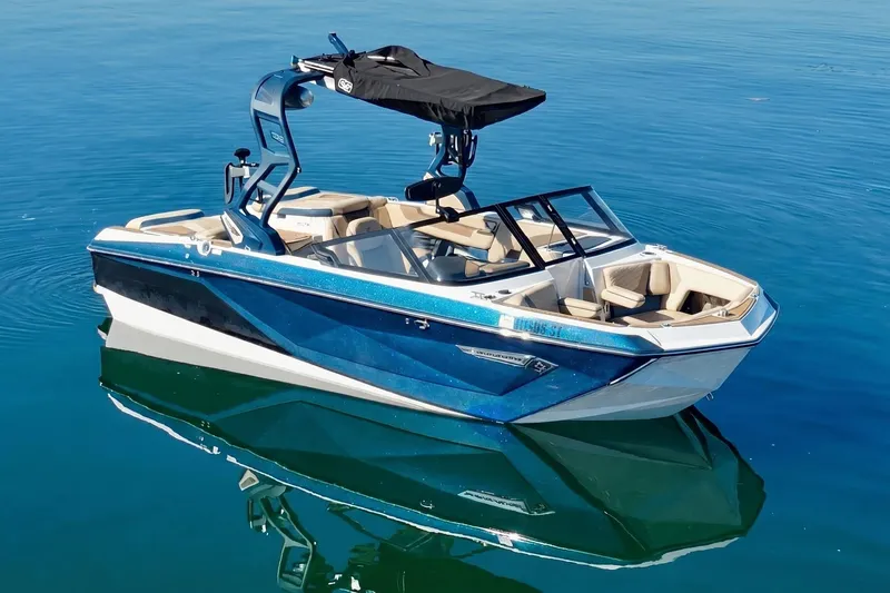 The Image of 2021 Nautique Super Air Nautique G21 boat on calm blue water. - 0