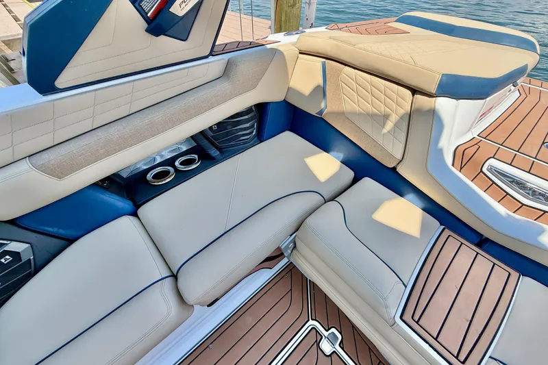 Slide: The Image of Luxurious interior of 2021 Nautique Super Air Nautique G21 boat with plush seating. - 15