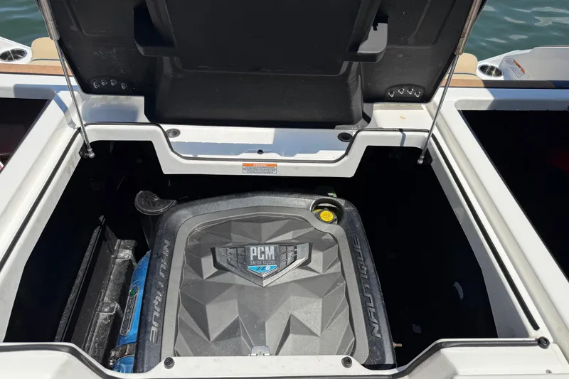 Slide: The Image of Open engine compartment of 2021 Nautique Super Air Nautique G21 boat. - 21