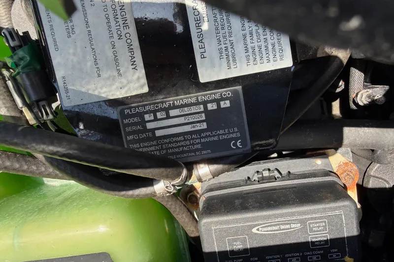 Slide: The Image of Close-up of a 2021 Nautique Super Air Nautique G21 engine label. - 22