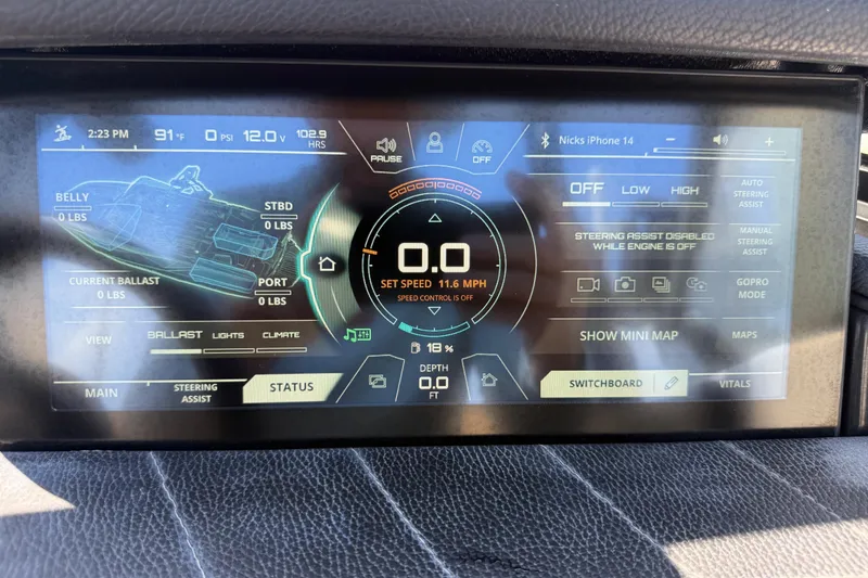 Slide: The Image of Dashboard of a 2021 Nautique Super Air Nautique G21 showing speed and ballast controls. - 24