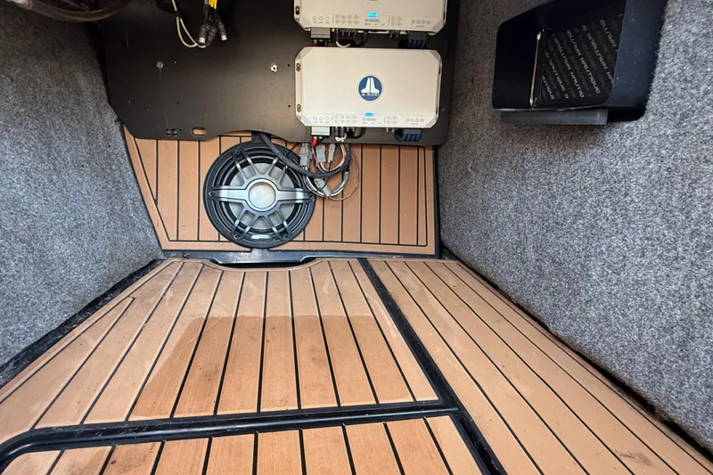 Slide: The Image of 2021 Nautique Super Air Nautique G21 interior with speaker and electronic components. - 27