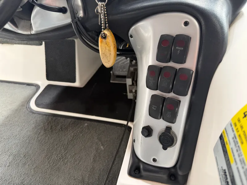 Slide: The Image of Dashboard of a 2005 Stratos 294 Pro XL with switches. - 15