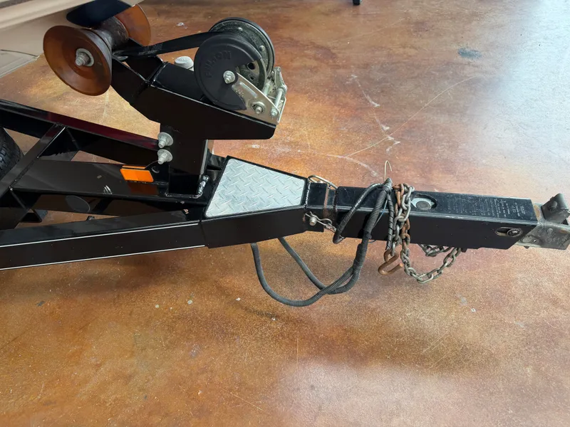 Slide: The Image of Trailer hitch of a 2005 Stratos 294 Pro XL boat trailer. - 21