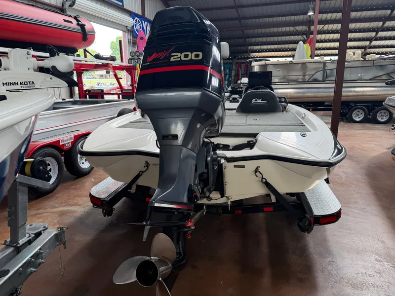 Slide: The Image of 2005 Stratos 294 Pro XL boat with outboard motor in warehouse. - 3