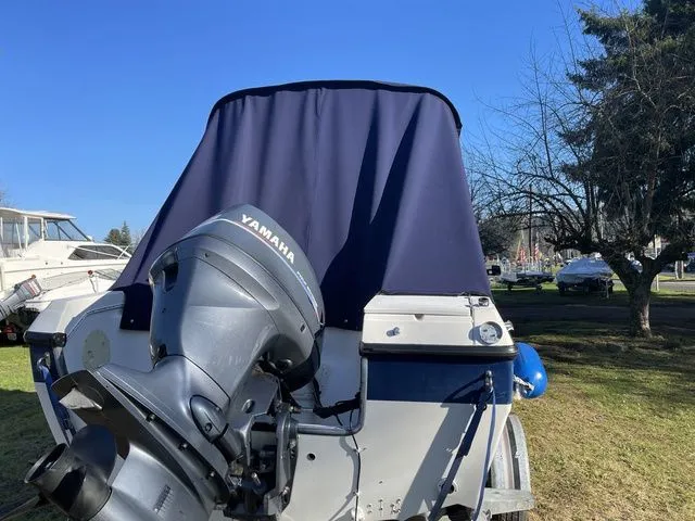 Slide: The Image of 1994 Livingston Viking boat with Yamaha outboard motor. - 3