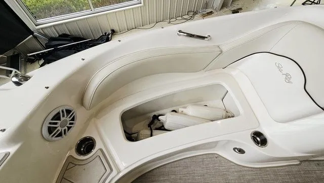 Slide: The Image of Interior of 2012 Sea Ray 200 Sundeck with storage and speaker. - 19