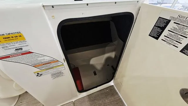Slide: The Image of Storage compartment in 2012 Sea Ray 200 Sundeck boat. - 20