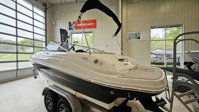 Slide: The Image of 2012 Sea Ray 200 Sundeck boat in a garage. - 3
