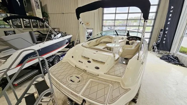 Slide: The Image of 2012 Sea Ray 200 Sundeck boat in showroom. - 5