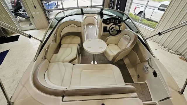 Slide: The Image of Interior view of a 2012 Sea Ray 200 Sundeck boat with seating area. - 6