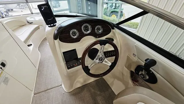 Slide: The Image of Interior view of 2012 Sea Ray 200 Sundeck helm. - 12
