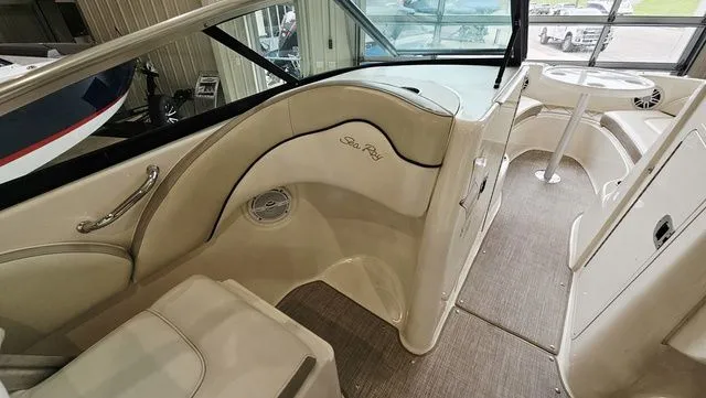 Slide: The Image of Interior of a 2012 Sea Ray 200 Sundeck boat, beige upholstery. - 13