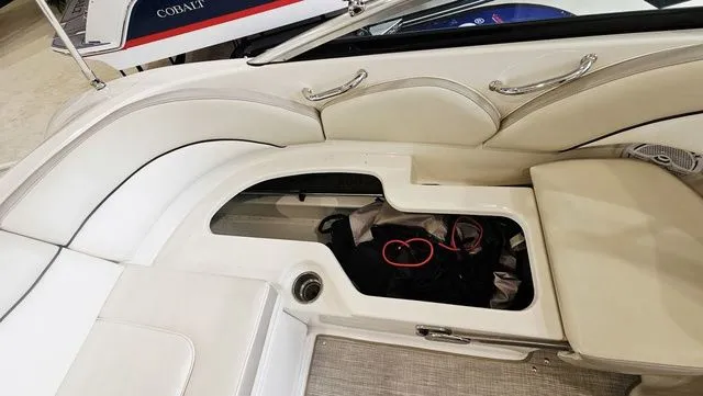 Slide: The Image of Interior of a 2012 Sea Ray 200 Sundeck with storage compartment. - 22