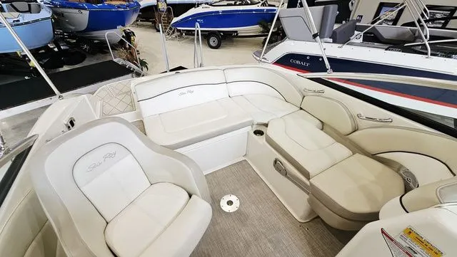 Slide: The Image of Interior of a 2012 Sea Ray 200 Sundeck boat with white seating. - 8