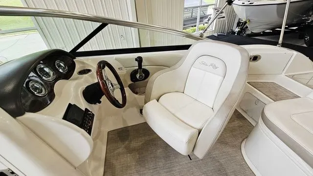 Slide: The Image of Interior of a 2012 Sea Ray 200 Sundeck boat with helm console. - 10