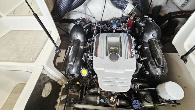 Slide: The Image of Engine compartment of a 2012 Sea Ray 200 Sundeck boat. - 23