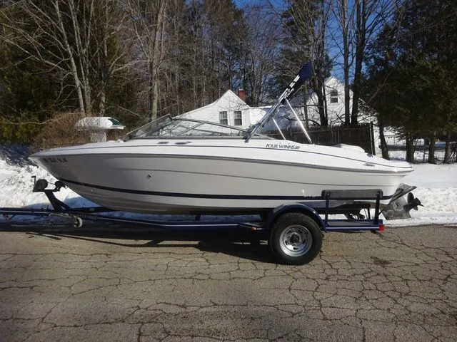 The Image of 2006 Four Winns 200 Horizon boat on trailer outdoors. - 1