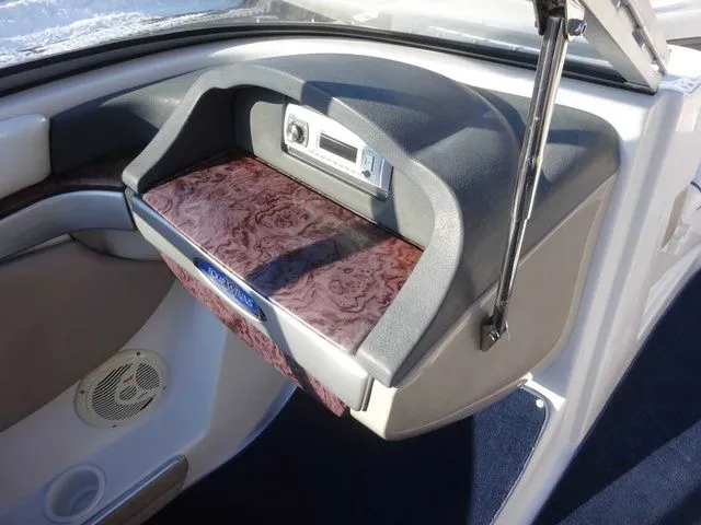 Slide: The Image of Interior of a 2006 Four Winns 200 Horizon boat with wood paneling. - 13