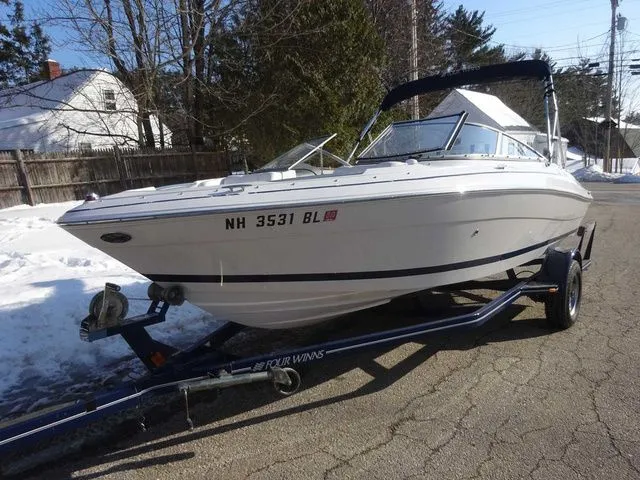 Slide: The Image of 2006 Four Winns 200 Horizon boat on trailer outdoors. - 2