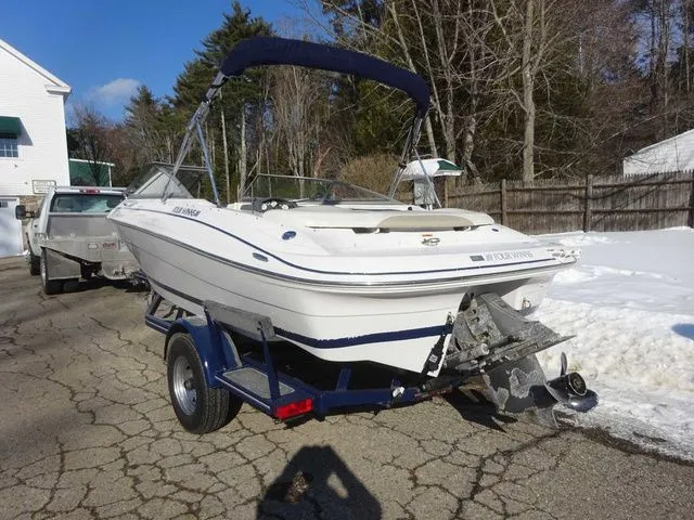 Slide: The Image of 2006 Four Winns 200 Horizon boat on trailer outdoors. - 3